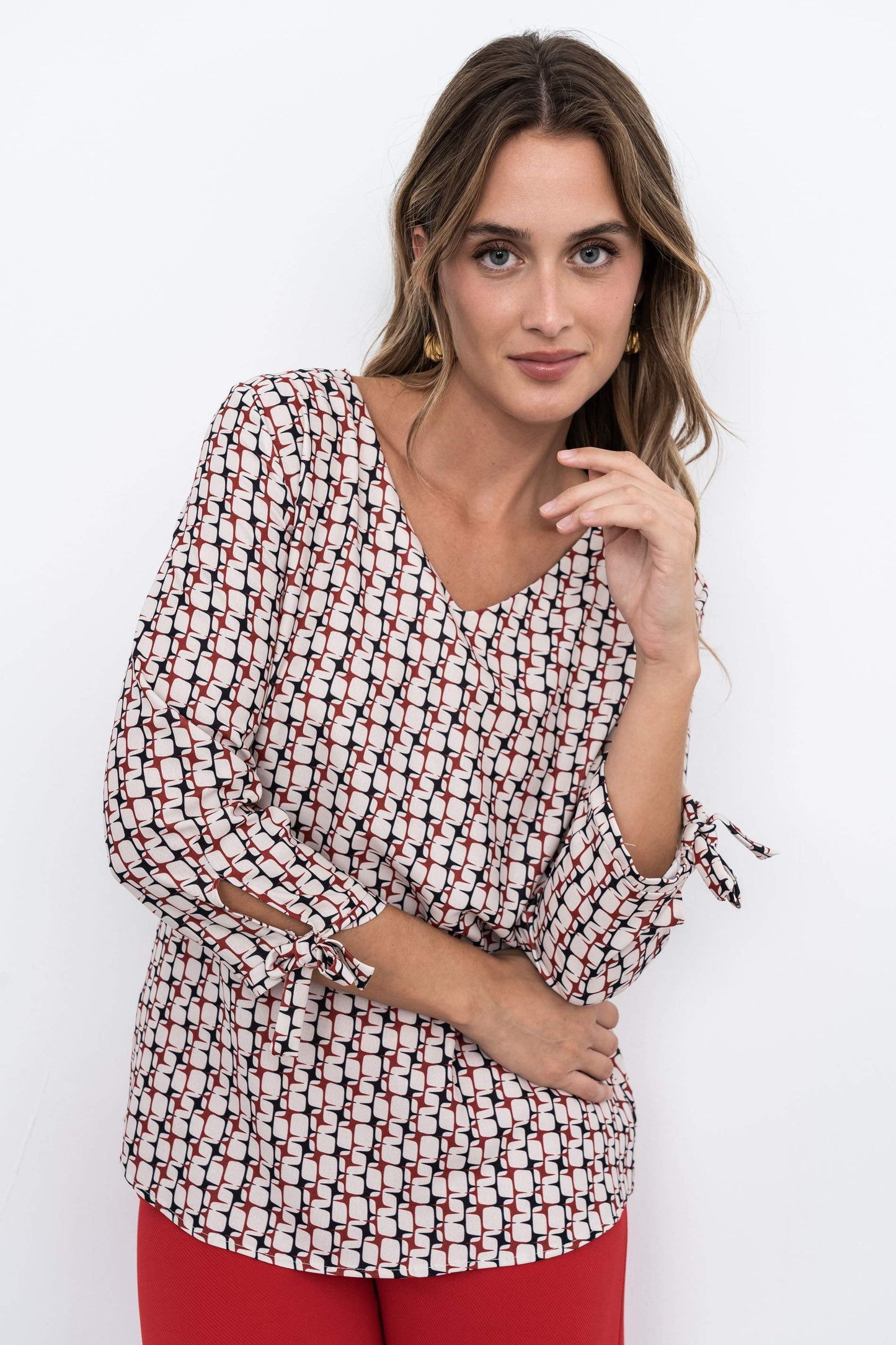 BLUSA GEOMETRICOS CUELLO PICO